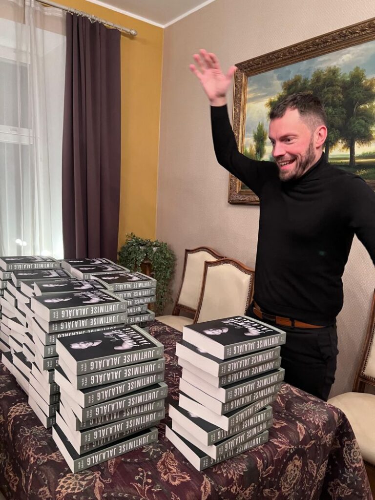 Pictured: Ivar Raav and the first books intended for signing.